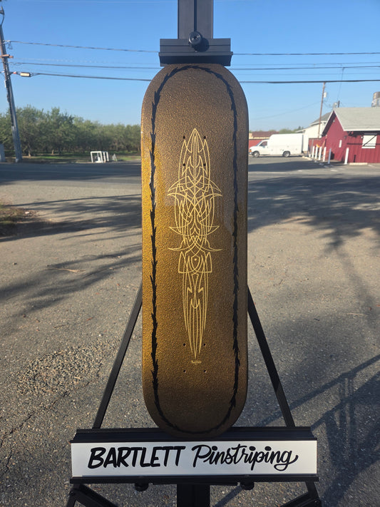 Gold pebble skate deck